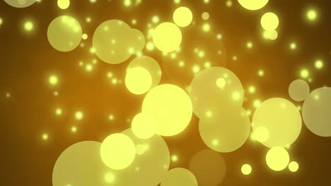 glowing yellow christmas light particles and bokeh lights moving across dark background