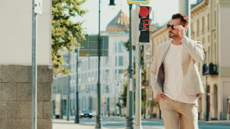 stylish man walking in city street