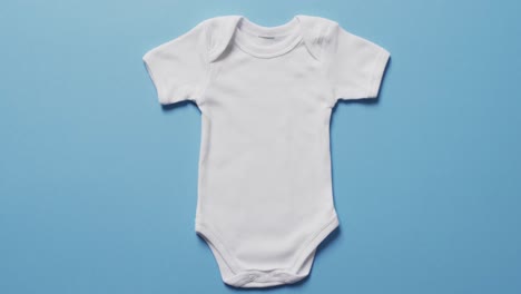 video of whit baby grow with copy space on blue background