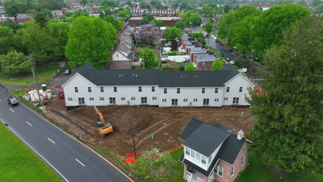 Aerial-pull-back-of-new-apartment-complex-in-city