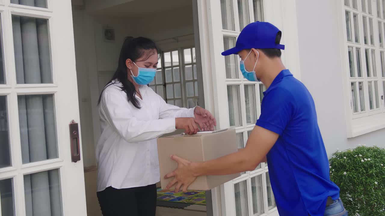 Delivery Person and Woman Receiving Package at Home