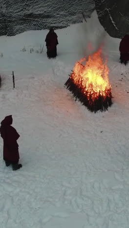 winter ritual by people in robes