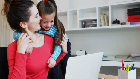 Mother-and-daughter-using-laptop-4k