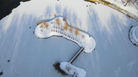 frozen, snowy island in the park