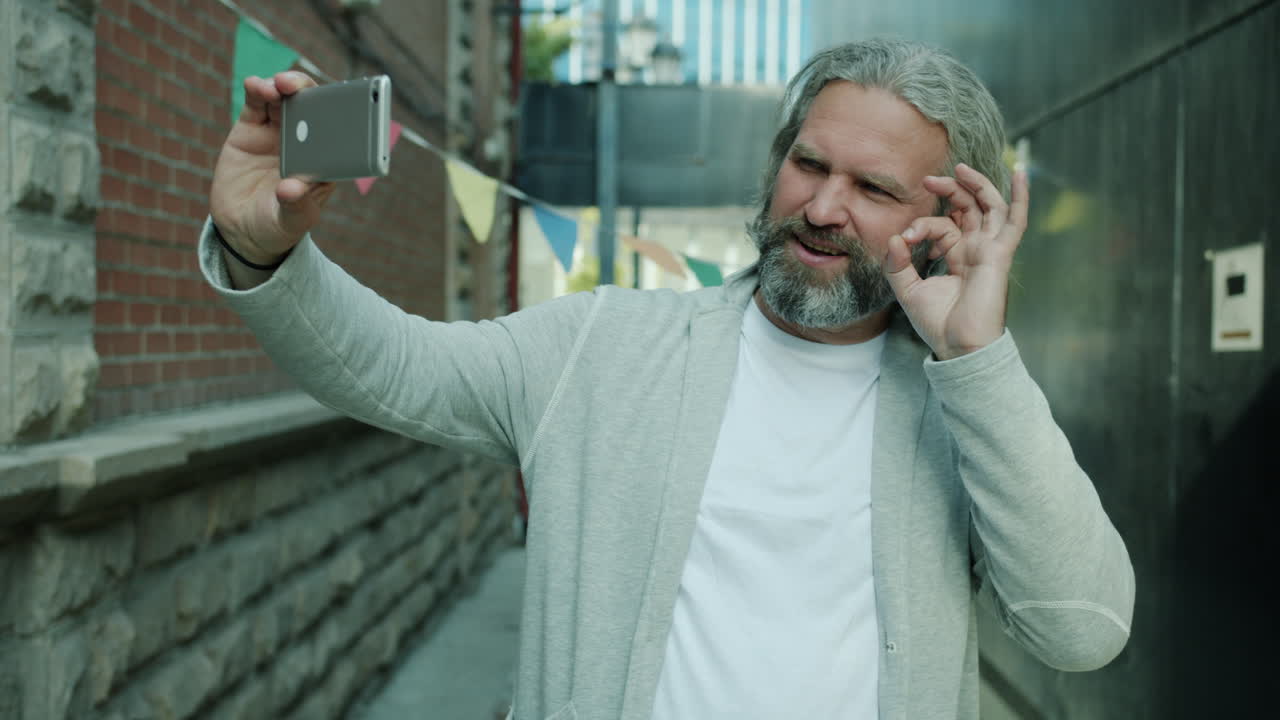 Man taking a selfie in an alley