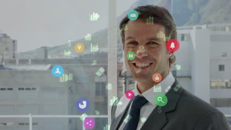 The-businessman-is-turning-to-the-camera-and-smiling-in-his-office