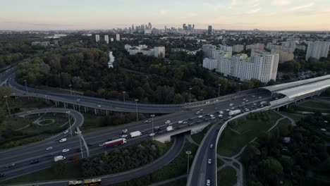 aerial view of warsaw highway and cityscape at sunset