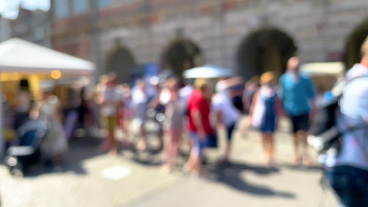 Blurred Shot Of People Strolling Around In Gdansk, Poland On A Sunny Day - defocused, slow motion