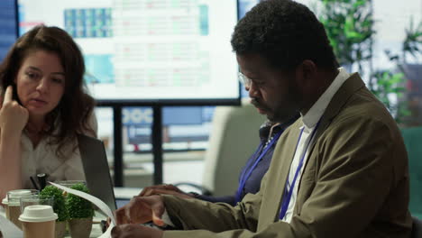 shareholder examining infographics and resource allocation on tablet