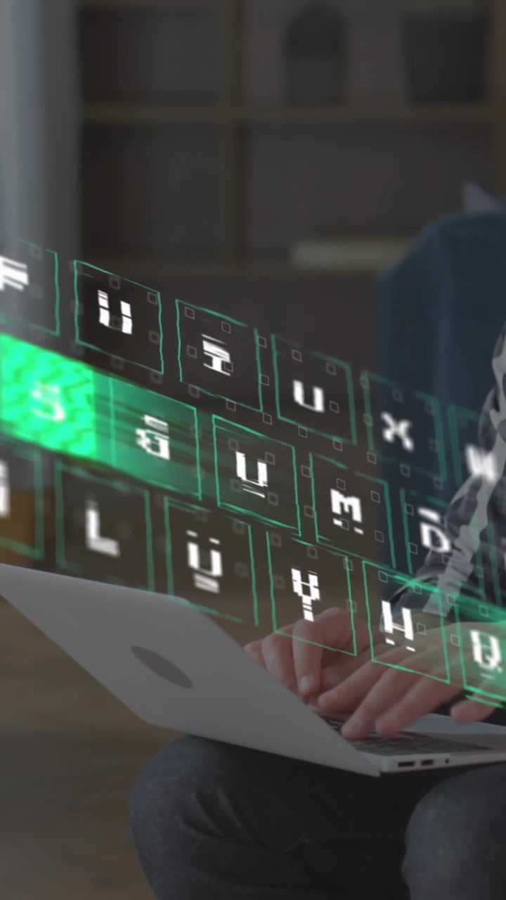 Animação de padrão iluminado movendo-se no teclado sobre um homem caucasiano trabalhando em um laptop.