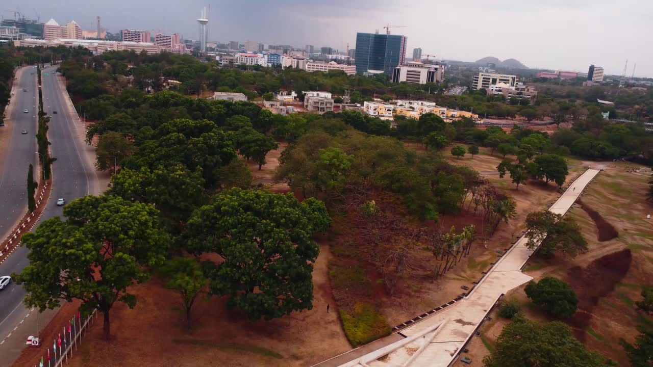 Lush green oasis with urban skyline - Millennium Park in Abuja, Maitama district