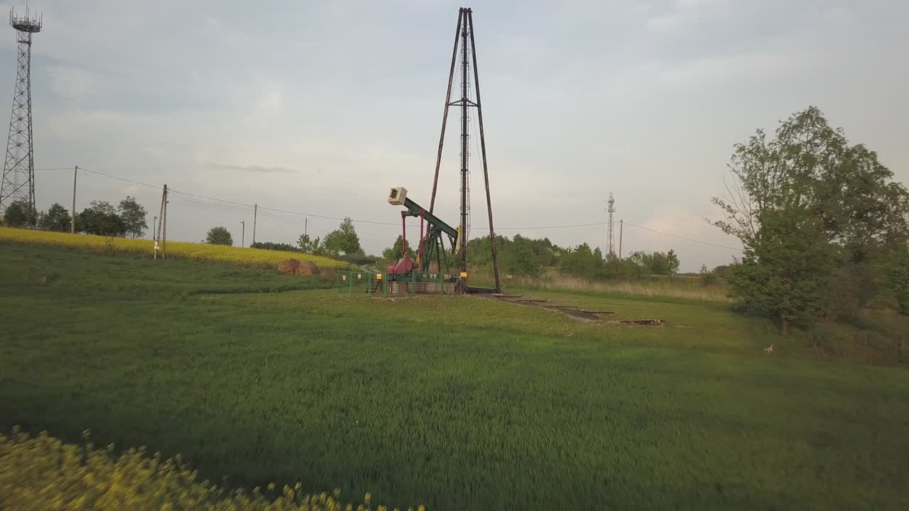Working oil pump station in the raps field. Tansport and distribution of oil. Technology of transportation system. Training manual for oil refining. Extraction of natural resources. Alternative fuel.