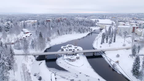 drone tilting over the kajaani castle, cloudy, winter day in kainuu, finland