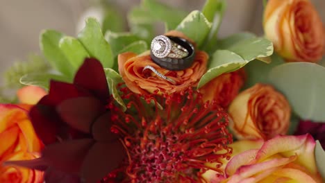 bride-and-groom-wedding-bands-on-bouquet