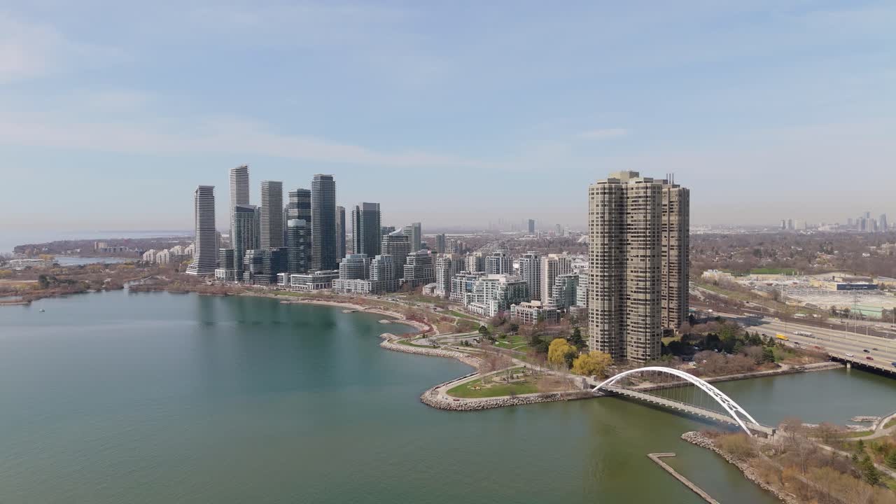 Condo buildings along Humber Bay with bridge, water and skyline in Parklawn, Toronto