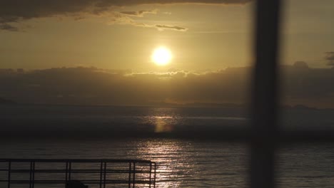 a serene sunset captured from the deck of a boat in costa rica crossing to guanacaste
