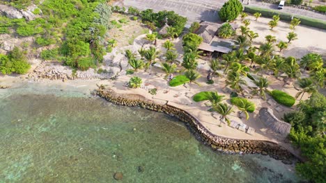 Drone-high-angle-view-of-Kokos-beach-resort-bay-by-Zanzibar,-Curacao