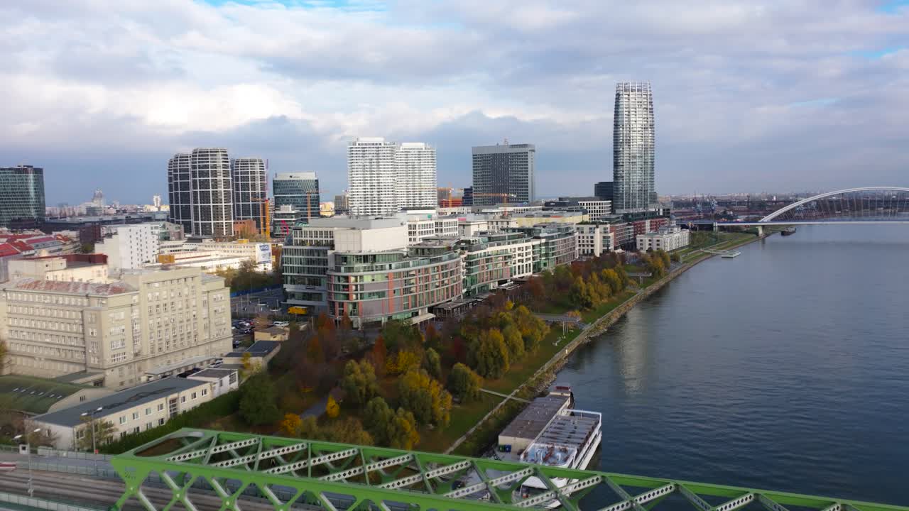 4K Aerial view of Bratislava city, showcasing the vibrant cityscape, historic old town, modern skyline, and the Danube River flowing through the capital. Slovakia_06