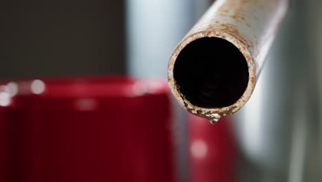 rusty pipe dripping water