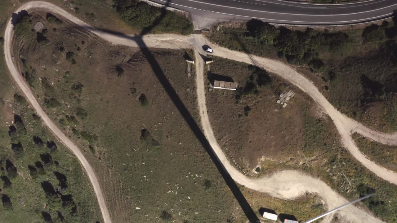 Aerial View of Wind Farm in Mountainous Terrain