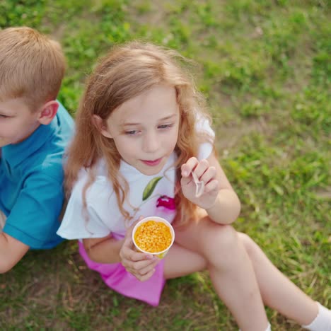 childs eating on nature