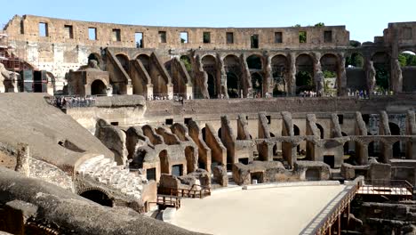 arena coliseum at evening time, with tourists inside