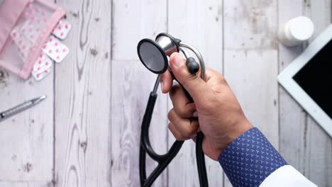 doctor examining patient with stethoscope