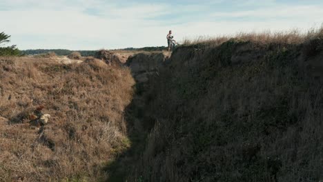 Father-and-baby-in-stroller-going-for-a-hike-while-learning-to-fly-their-drone