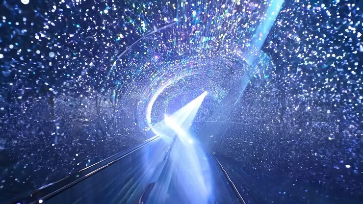 Escalator ascending through a glowing tunnel filled with sparkling lights creates a modern, futuristic atmosphere