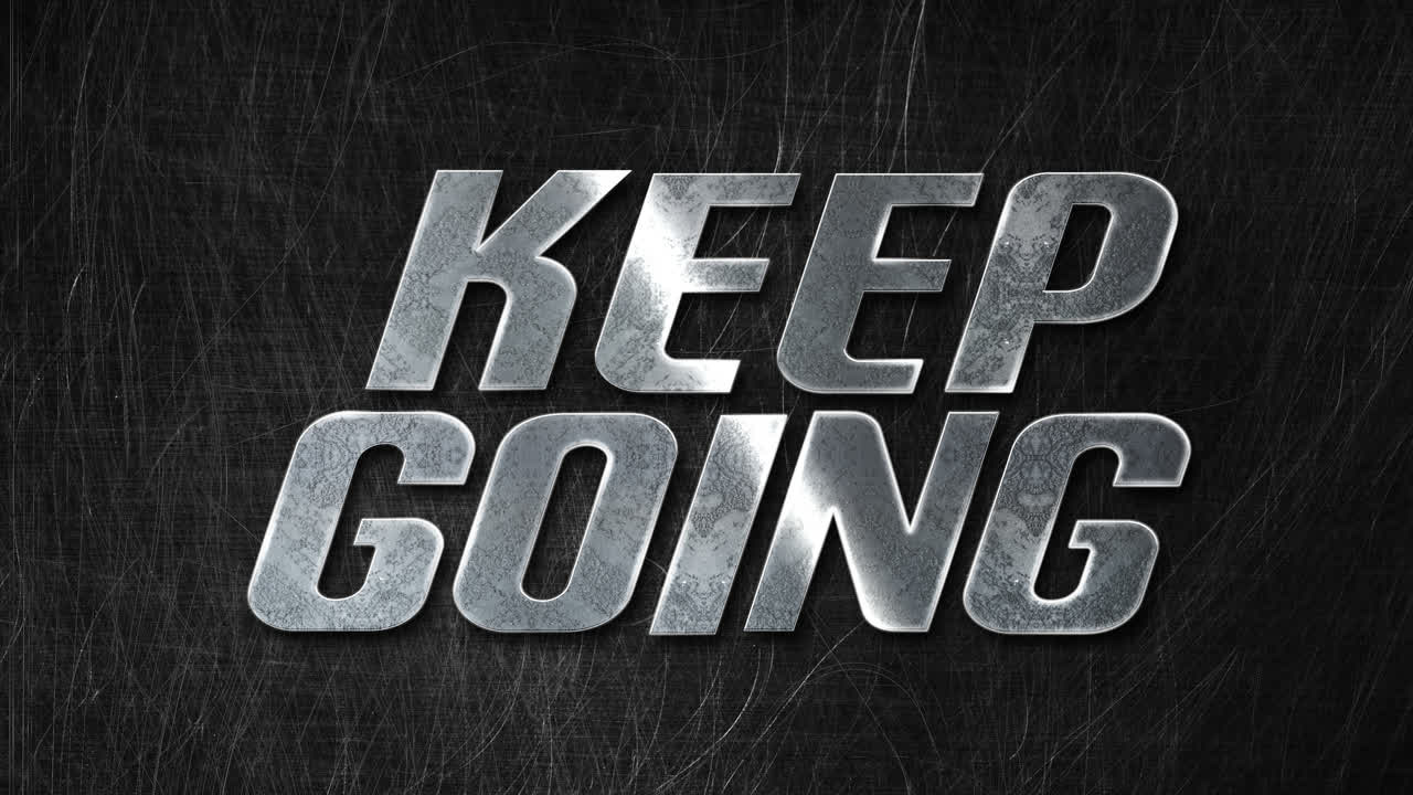 Motivational 'Keep Going' Message in Metallic Text