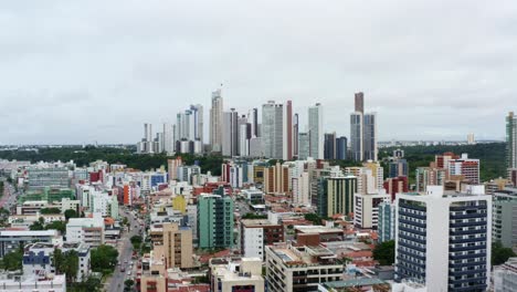 aerial drone shot of the cityscape of the colorful tropical beach capital city of joao pessoa in paraiba, brazil from the tambaú neighborhood on an overcast morning