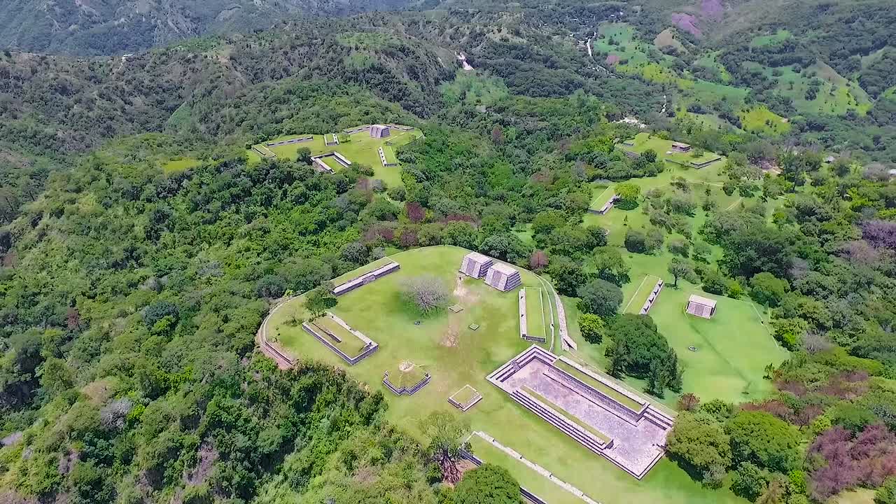 A beautiful sunny day in the green forest on the mountains of Tikal ruins.
