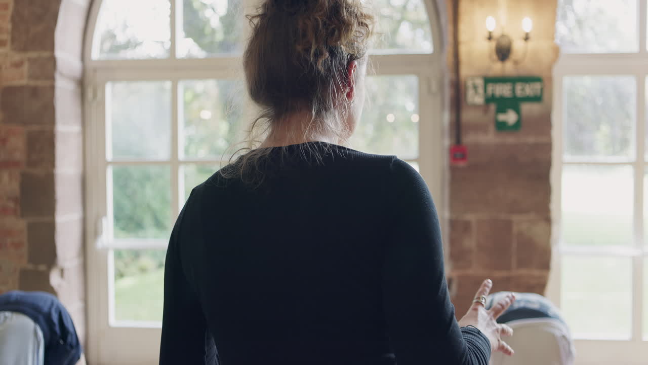 Yoga class practicing downward dog