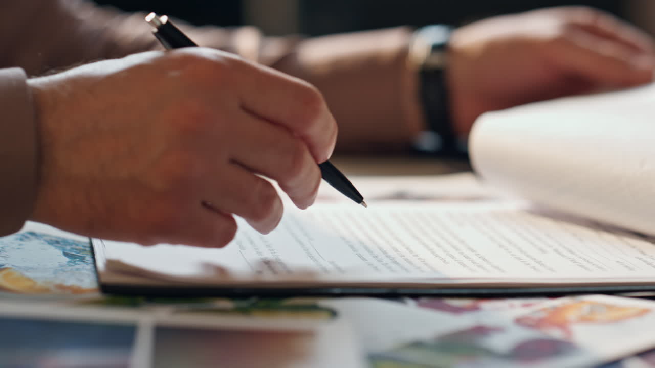 Closeup businessman hand signing contract at office table. Man putting signature