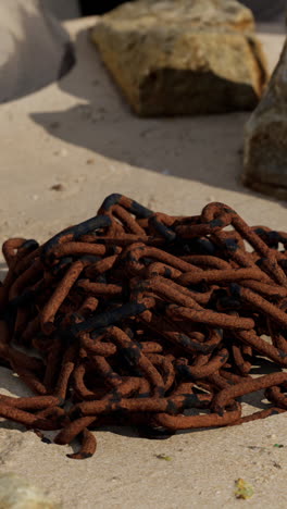 a rusty chain on the beach