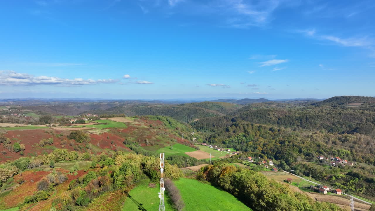 Aerial view of telecommunication tower on autumn hill