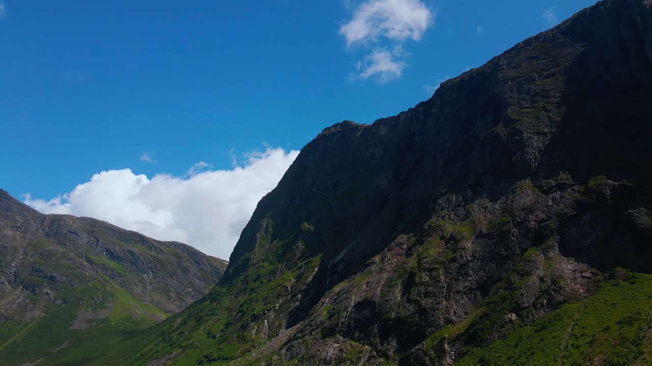 Drone looking towards a mountaintop in Norangsdalen on a sunny summer day in Norway