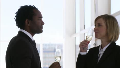 Two-business-people-toasting-their-success