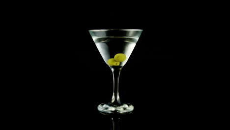 Video-of-glass-of-martini-on-black-background