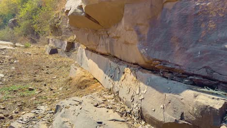 slow push in dolly shot of a rock or bolder in mountainous terrains,