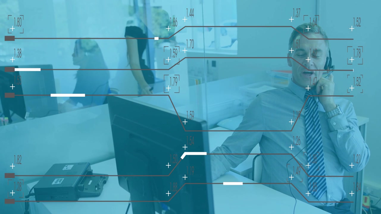 Businessman at desk with data processing animation over office environment