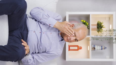 Vertical-video-of-Old-lonely-man-crying-depressed.