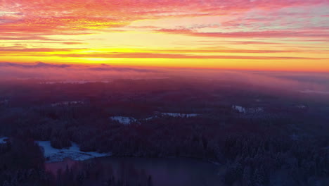 Fire-sunset-with-vibrant-sky-over-horizon-aerial