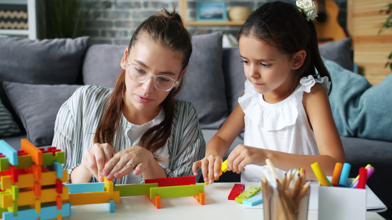 Woman and child playing with building blocks