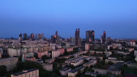 aerial orbital view, cityscape of warsaw skyline at blue hour