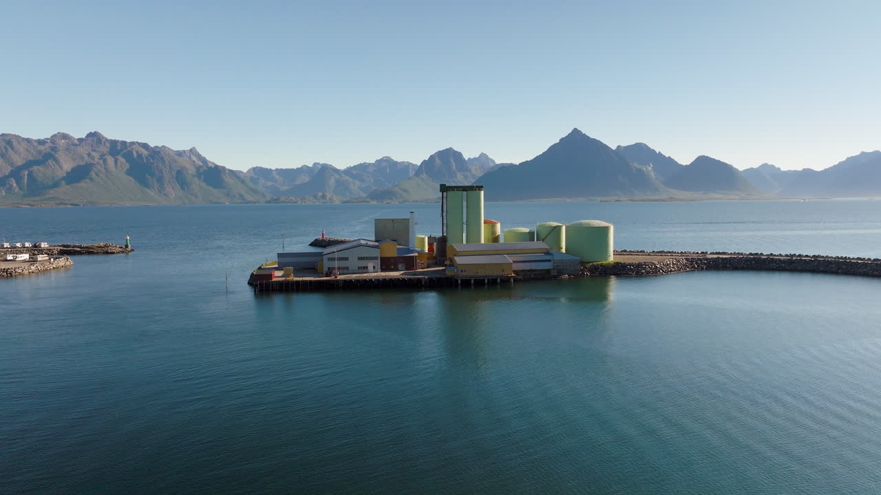 Industrial Silos Standing Along the Rugged and Windy Shores of Coastal Norway