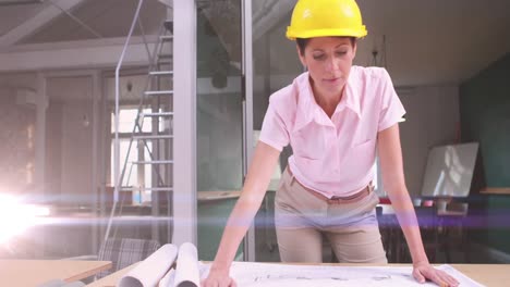 Animation-of-light-trails-over-caucasian-female-engineer