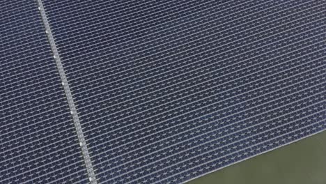 Aerial-view-of-Floating-solar-panels-in-a-small-pond