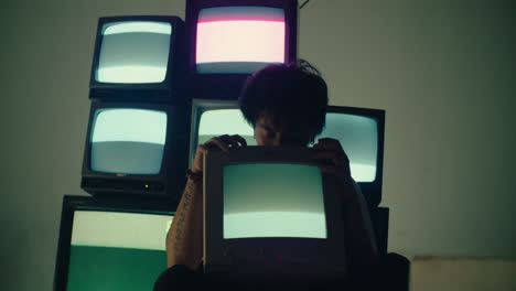 young male hug cat television with monitor glowing room , mental health and media addiction concept