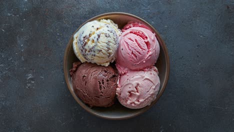 three scoops of ice cream in a bowl